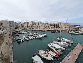 Boats moored at harbor