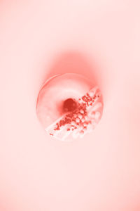Close-up of pink water over white background