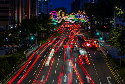 High angle view of light trails on road at night