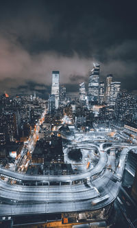 High angle view of illuminated buildings in city at night