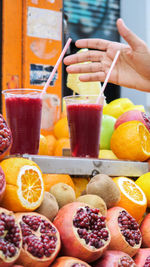 Midsection of man with fruits