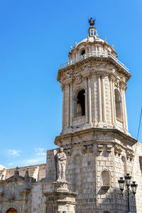 Low angle view of church against blue sky at historic centre of arequipa