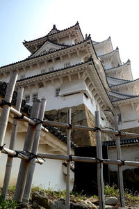 Low angle view of abandoned building against clear sky