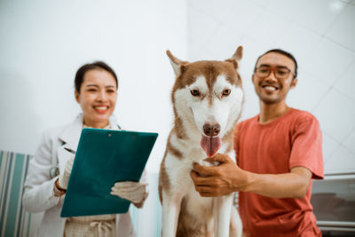 Portrait of man with dog