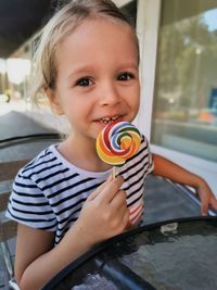 Portrait of cute girl holding ice cream