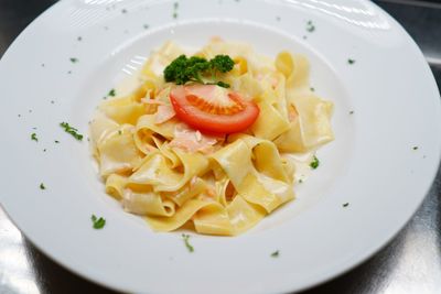 Close-up of pasta served in plate on table