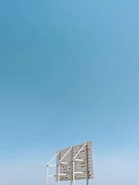 Low angle view of house against clear blue sky