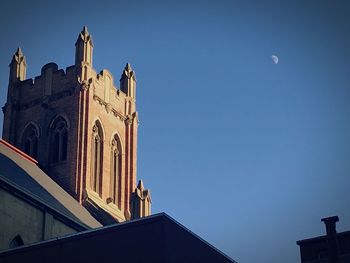 Low angle view of church against blue sky