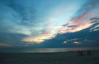 Scenic view of a beach against sky during sunset