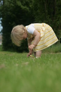 Rear view of girl on field