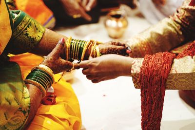 Midsection of women in temple