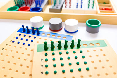 High angle view of multi colored toys on white background