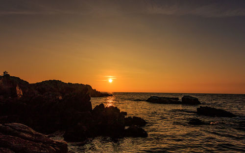 Scenic view of sea against sky during sunset