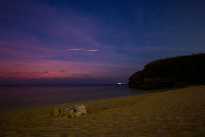 Scenic view of sea against sky at night