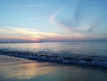 Scenic view of sea against sky at sunset