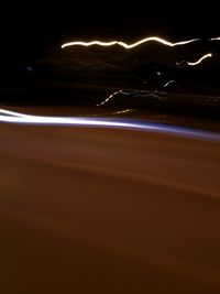 Close-up of illuminated light trails at night