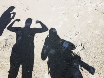 Shadow of people on sand