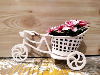 Close-up of roses in basket on table