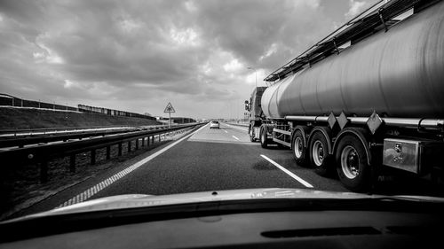 Truck on road seen through car windshield