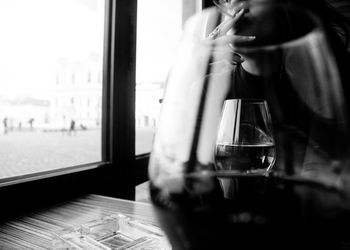 Close-up of woman on glass window