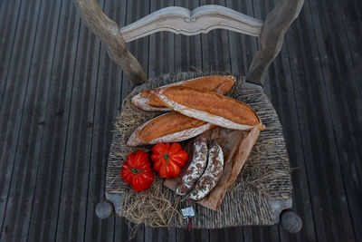 Close-up of food on a rustic chair