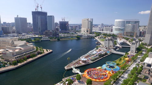 High angle view of river amidst buildings in city