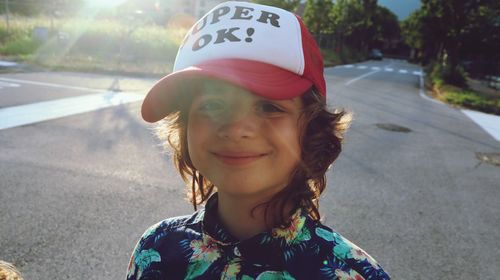 Portrait of smiling girl on road