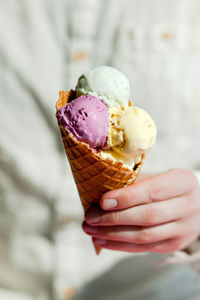 Cropped image of hand holding ice cream