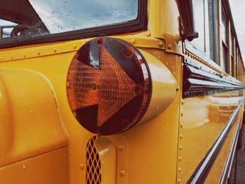 Close-up of yellow bus in city