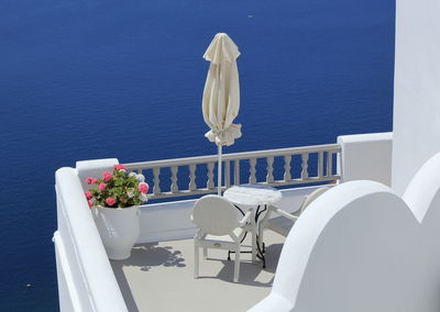 View on balconies oia village in the caldera by day, greece
