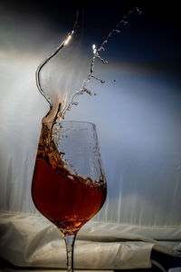 Close-up of wineglass on table