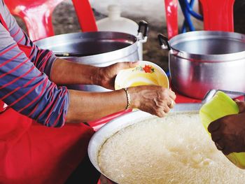 Midsection of woman preparing food