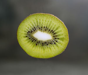 Close-up of lemon slice over white background