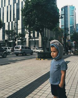 Portrait of boy in city street