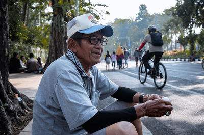 People riding bicycle on road