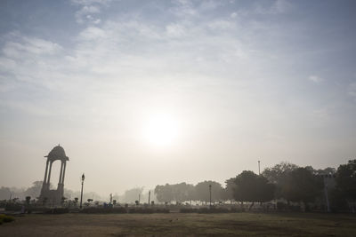 Scenic view of grassy field against sky