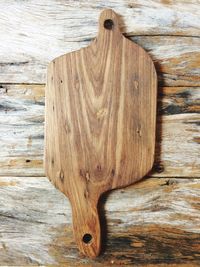 Directly above shot of wooden cutting board on table