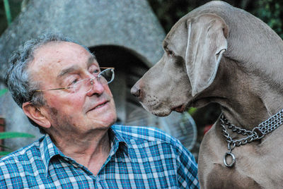 Portrait of old man and dog