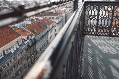 High angle view of buildings seen through fence