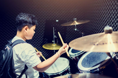 Young man playing music concert