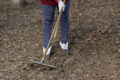 Low section of man standing on mud