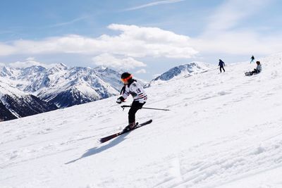 People on snowcapped mountain