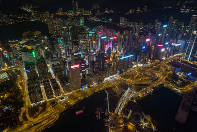 Aerial view of illuminated buildings in city at night