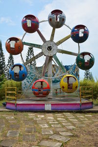 Ferris wheel in park against sky