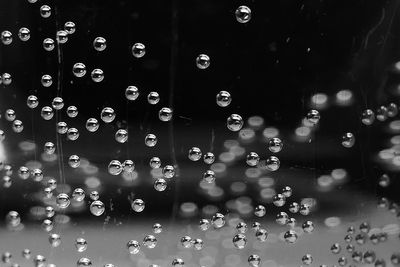 Close-up of water bubbles in mid-air