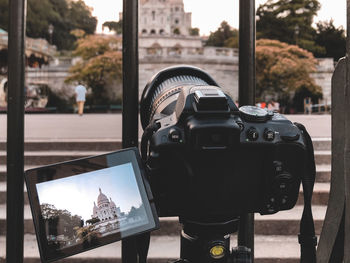 Close-up of camera in city