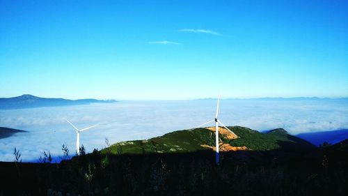 Scenic view of landscape against blue sky