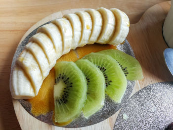 High angle view of fruits in plate on table