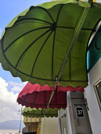 Low angle view of parasol against sky