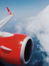 Low angle view of airplane flying against sky